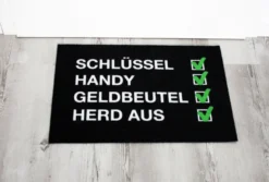 Checkliste Fußmatte Schlüssel, Handy, Geldbeutel, Herd aus