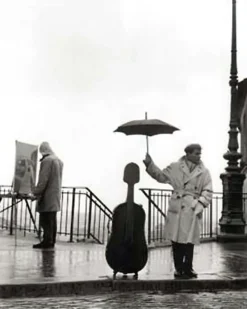 Ein Musiker im Regen Kunstdruck Robert Doisneau